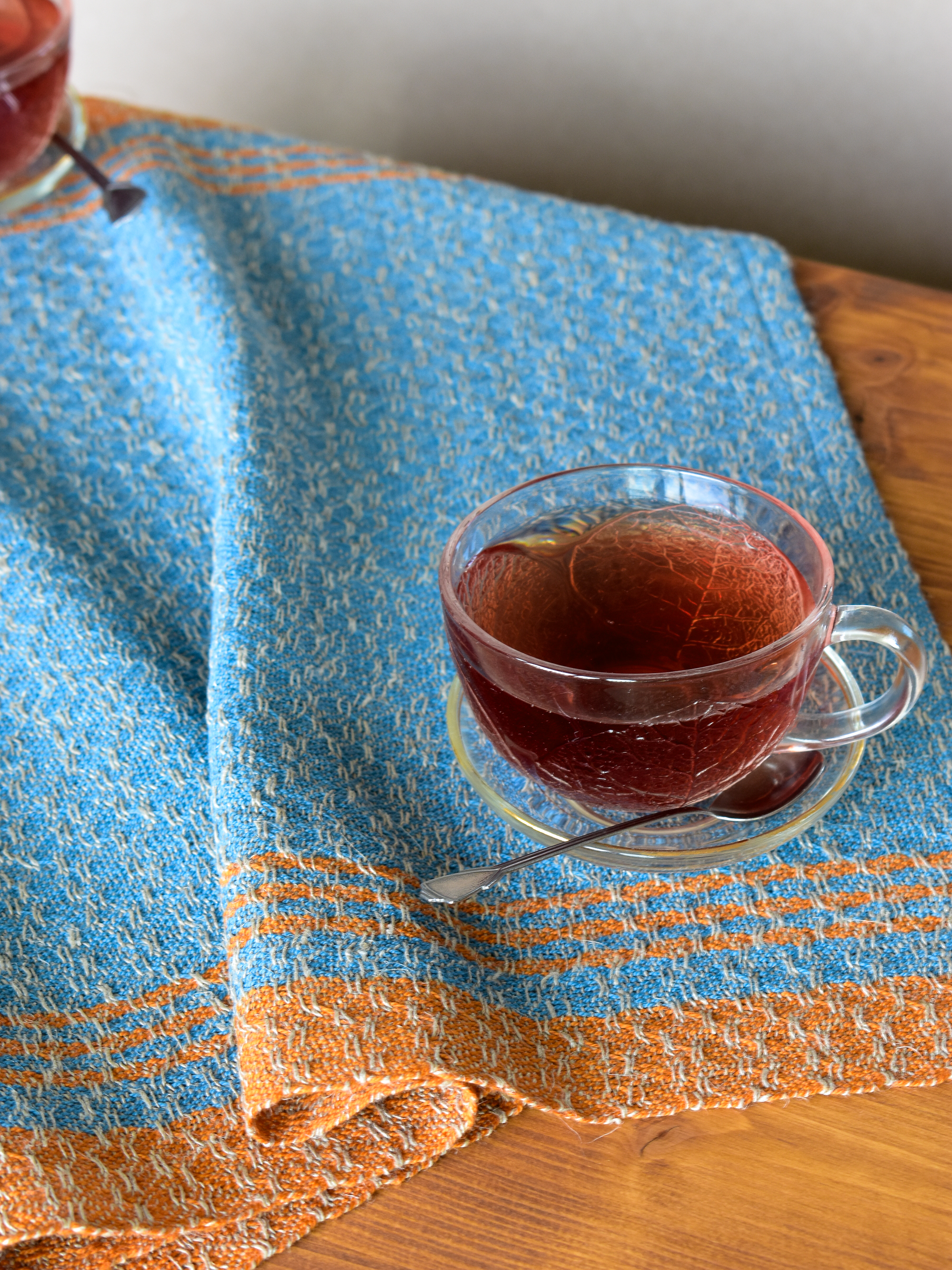 Towel in use with a cup of tea on it